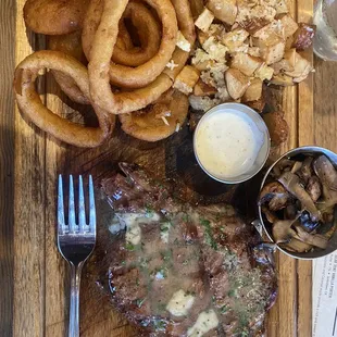 The Ribeye chefs choice steak with onion rings garlic herb butter, red potatoes and sautéed mushrooms! With homemade ranch