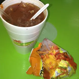 Clamato con todo y hott cheetos con queso