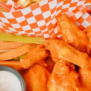 Buffalo wings and a basket of fries