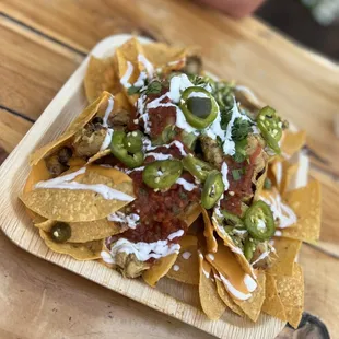 Nachos with jerk chicken and guacamole