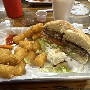 Burger, tots, and corn in a cup.