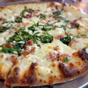 Custom personal pizza: bacon,  spinach,  and feta with white sauce