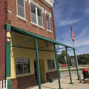 a red fire hydrant in front of the building