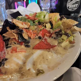 The nachos have the queso which ethically and morally confuses me.