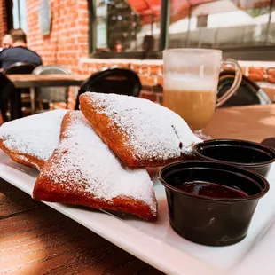 a plate of pastries and a cup of coffee
