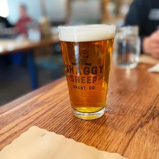 a glass of beer on a table