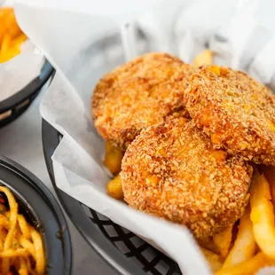 a basket of chicken nuggies and french fries