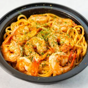 a bowl of pasta with shrimp