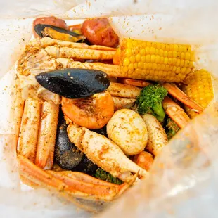 a variety of seafood in a plastic bag