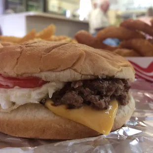 Cheeseburger with Cherryville classic toppings of tomato, slaw and pickle