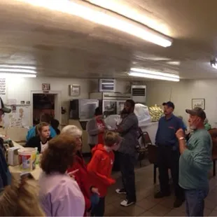 a large group of people in a shake shop