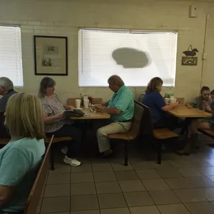 a group of people sitting at tables