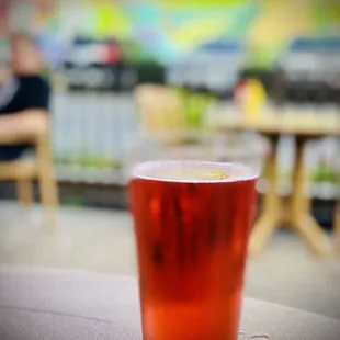 a glass of beer on a table