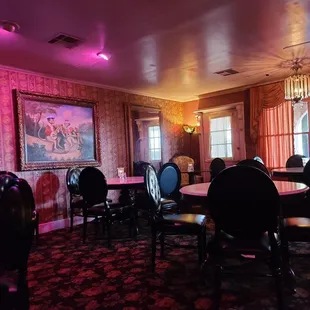 a dining room with tables and chairs
