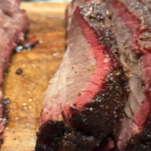 two slices of meat on a cutting board