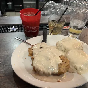 Chicken fried steak and mashed potatoes.