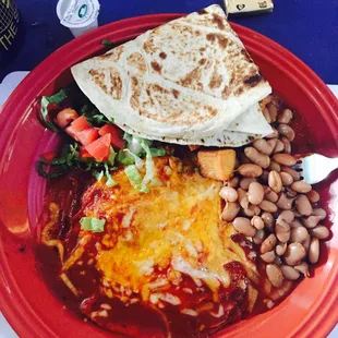 Huevos Rancheros with red chile, home fries and beans.