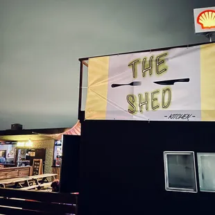 a restaurant with a sign that says the shed