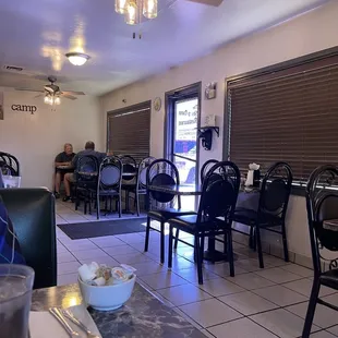 a dining room with tables and chairs