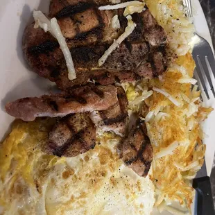 Pork chops with eggs and biscuit with side of gravy. Gravy was okay.