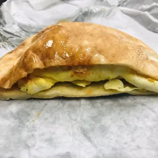 Pita- Sausage Egg Cheese with mayo and hot sauce.