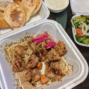 Lemon-oregano shish tawook was nicely flavored. With fresh salad, garlic sauce, and delicious pita.