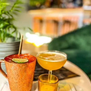 two cocktails on a table