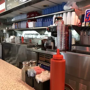 View from the counter. It&apos;s a legit diner. Counter and all.