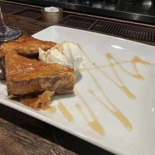 Baklava &amp; ice cream garnished in caramel sauce