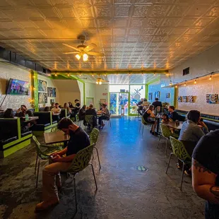 a group of people sitting at tables