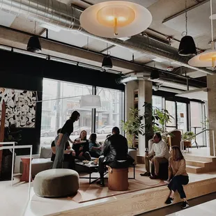 a group of people sitting around a coffee table