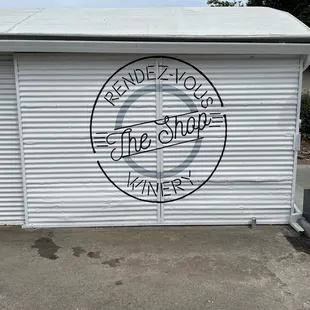 a garage door with the word rendez - vous painted on it