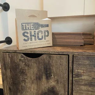 a box on top of a wooden cabinet