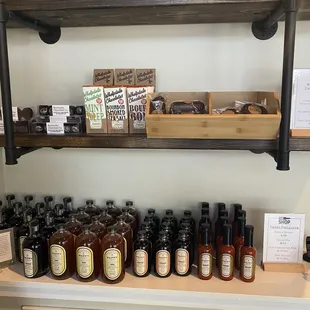 a shelf full of bottles of liquor