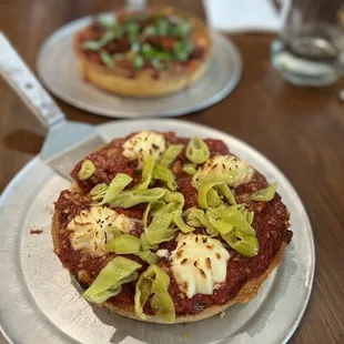 Personal deep dish~ ricotta, pepperoncini, jalapeños and roasted garlic