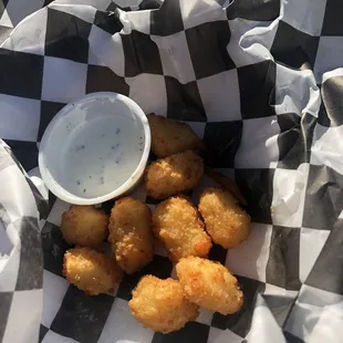 Half devoured white cheese curds.