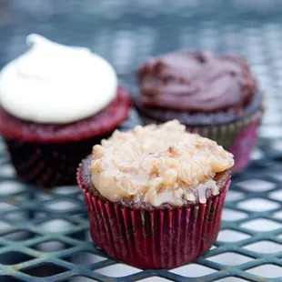 three cupcakes on a table
