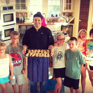 a group of people in a kitchen