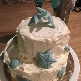 a white cake with blue decorations