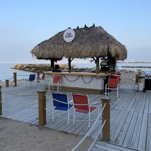 a tiki bar on the beach