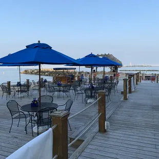 tables and umbrellas on the boardwalk