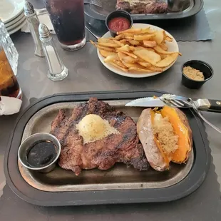 a plate of steak and french fries