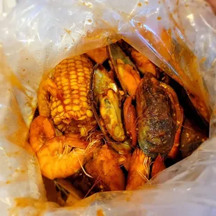 Canjun shrimps and mussels added potatoes, corn and sausages