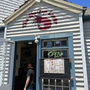 a woman entering a seafood restaurant