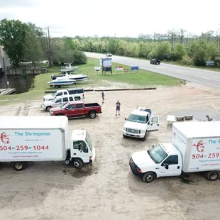 a group of trucks parked on the side of the road