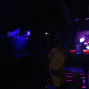 a group of people in a dark room