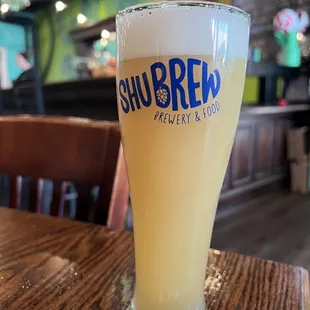 a glass of beer on a table