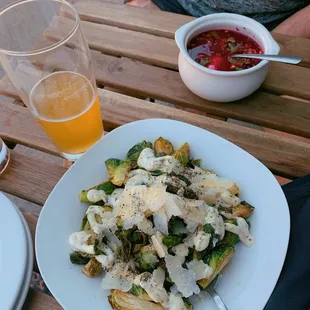 a plate of food and a glass of beer