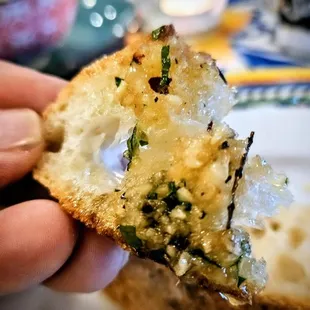 da infamous Olive Oil w/ spices, Rosa's influence for sure