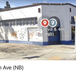 a white building with several signs on it